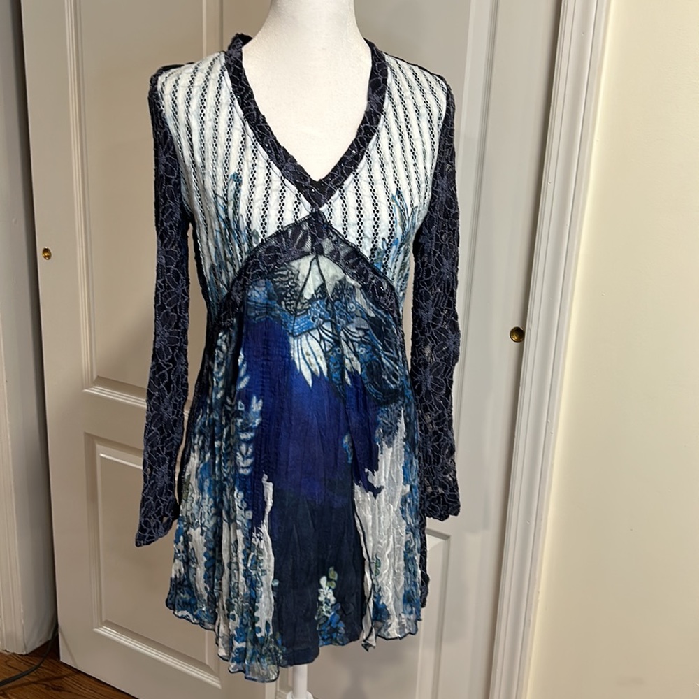 Beautiful new blue shirt with lace on the sleeves and sequins around the V- neck
